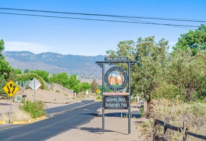 Corrales, NM welcome sign along dirt road