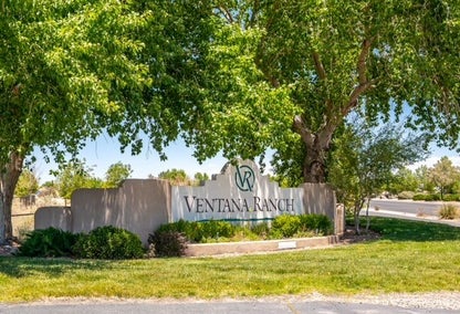 Stone welcome sign outside Ventana Ranch master-planned community, NM